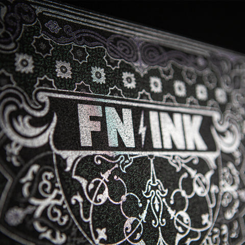 a silver print that says FN-INK