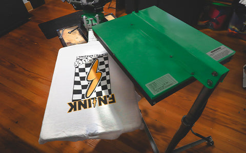 a flash dryer hovers over a yellow lightning bolt printed over a checkerboard pattern