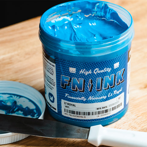 a light blue container of ink