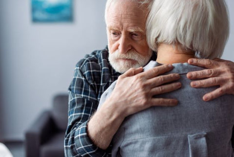 Senior woman hugged by Dementia patient