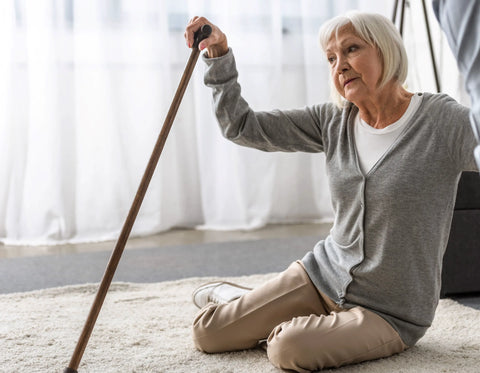 Person helping elderly relative get up