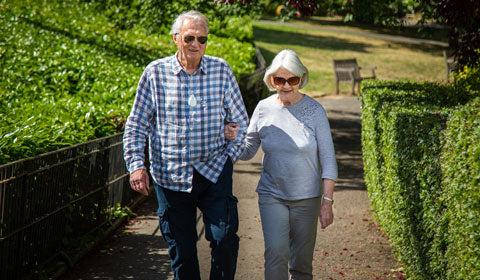 Elderly couple walking