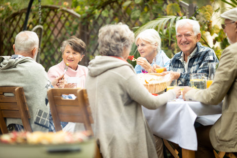 Elderly friends enjoying Christmas lunch