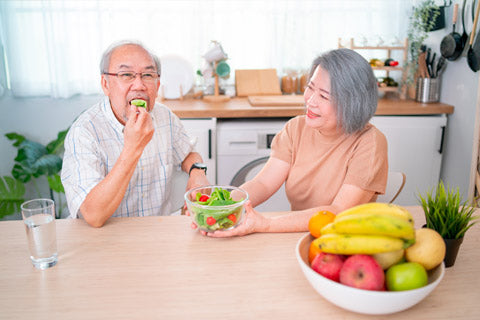 Elderly couple with healthy snacks