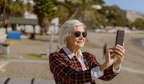 Elderly lady at beach