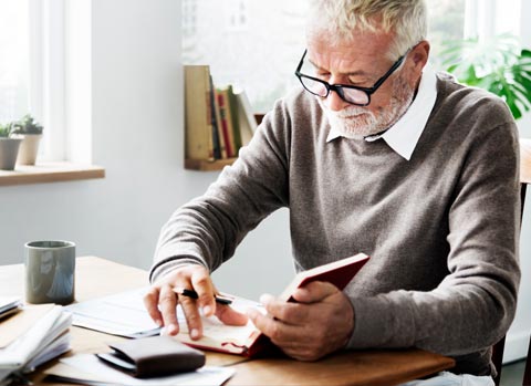 Elderly man reviewing will