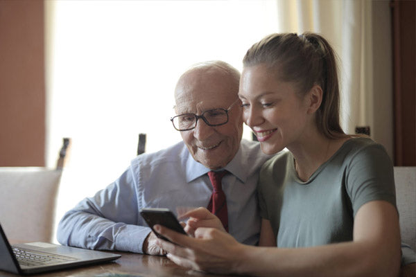 Elderly man using mobile phone