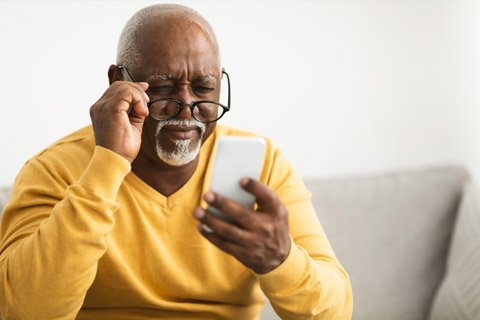 Elderly man struggling to see clearly