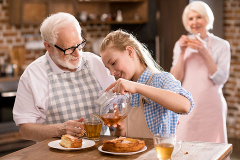 Elderly couple keeping themselves hydrated after baking