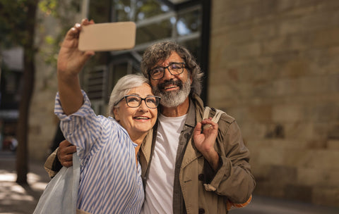 Senior couple taking selfie while travelling