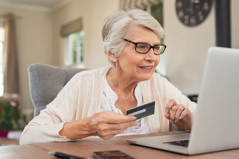 Elderly woman sending money online