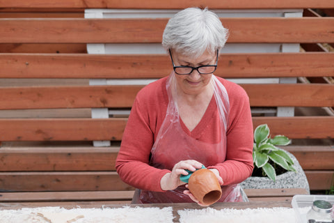 Elderly woman clay modelling