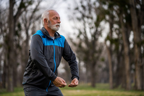 Elderly man practising Tai Chi