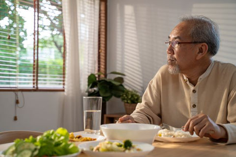 Old man eating alone