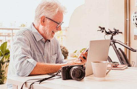 Elderly man staying connected with loved ones through video calls