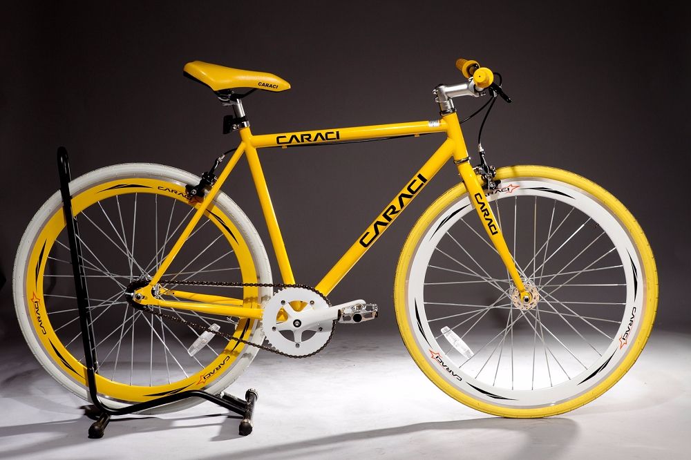 yellow fixed gear bike