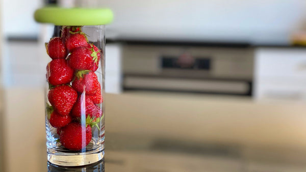Mason Jar with berries covered by a Food Hugger