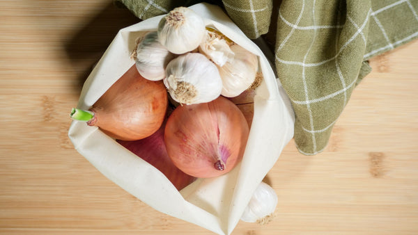 Onions and Garlic inside a Food Hugger Fabric Cuff Bag