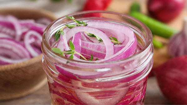 Pickled onions inside a glass jar