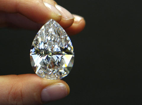 A 72.22 carat pear-shaped D-color diamond held during a media preview at Sotheby's in New York. Photographer: Andrew Harrer/Bloomberg News BLOOMBERG NEWS