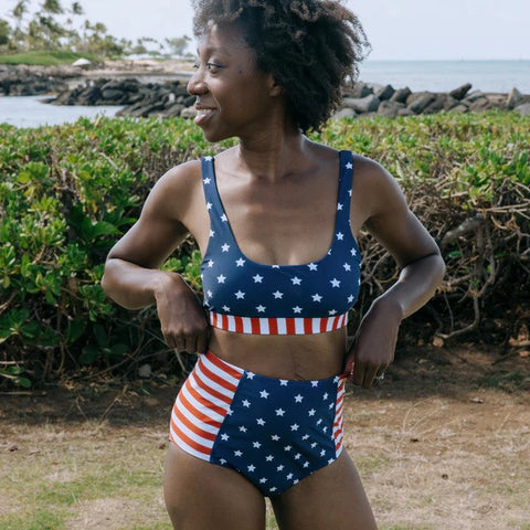 Woman in SwimZip Americana bikini poses at the beach—Types of bikini