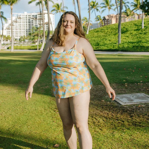 Woman in a SwimZip tankini top posing during a hot summer day—Best bathing suits for women.