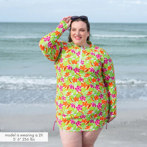 Woman in a SwimZip swim dress walks around the beach—Best swimsuits