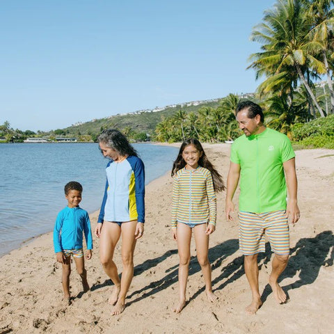 Family in SwimZip matching collection on the beach—Best swimsuits