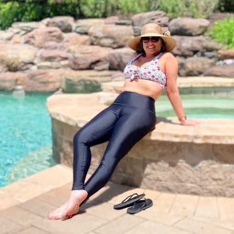 Woman in SwimZip swim pants enjoys sun—How to get rid of sun tan.