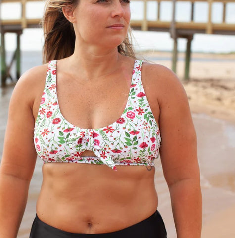 Woman wearing tie bikini top floral garden