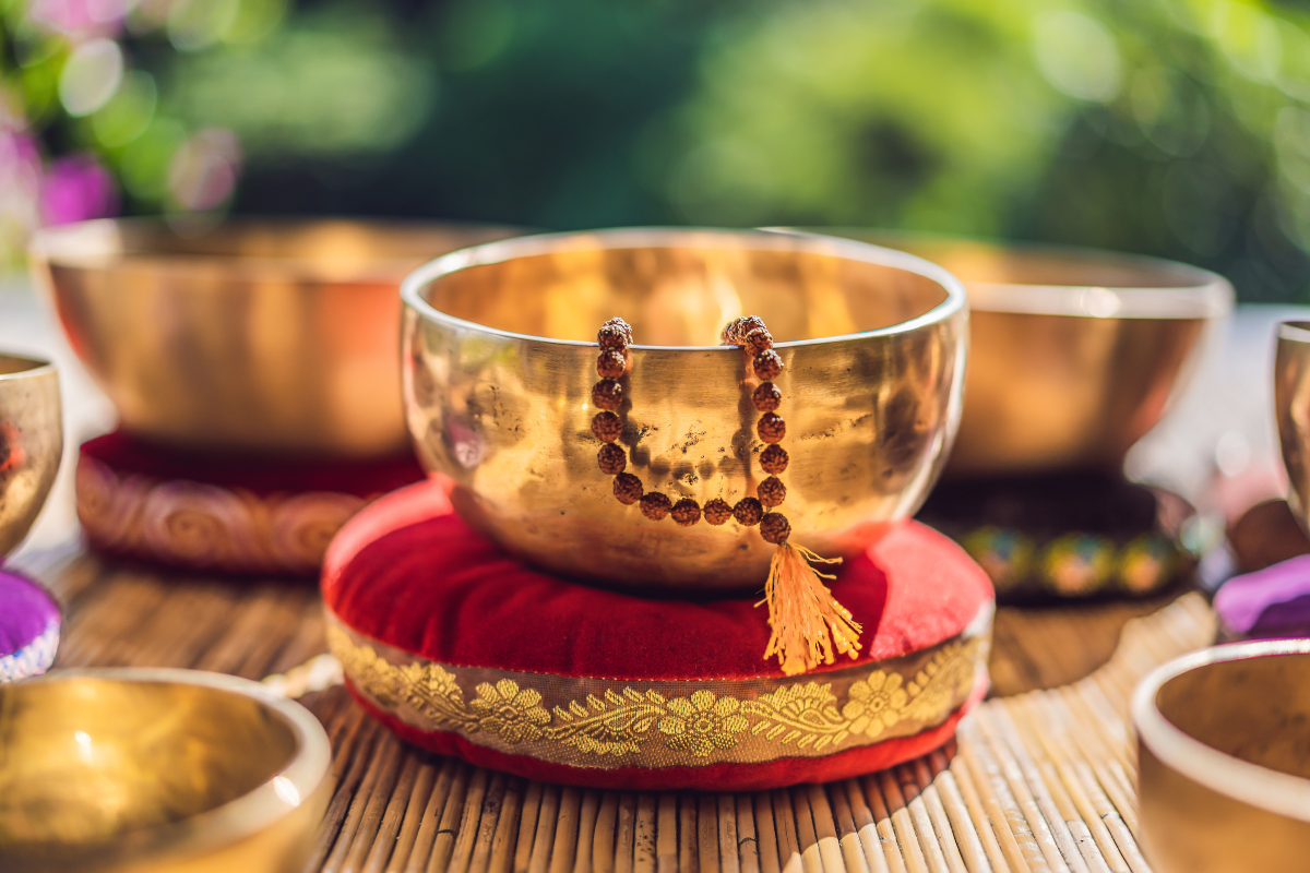 Singing Bowl resting snugly in a soft, plush cushion. The bowl appears to be well-maintained, with no visible scratches or dents, and is ready to be played for its soothing sound vibrations. 