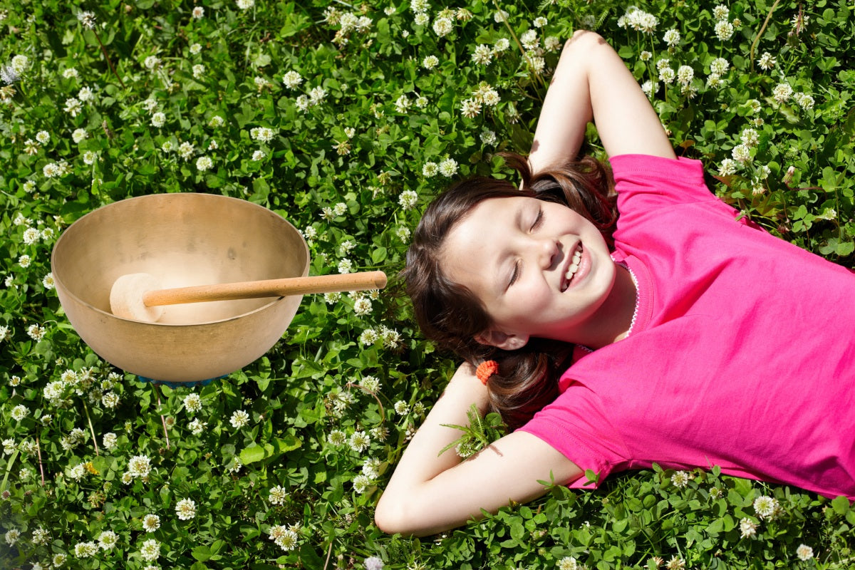 Young Child relaxed with singing bowl sound