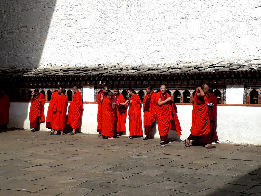 Monks at Rinpung Dzong also known as the Fortress of heaped jewels in Paro, Bhutan.