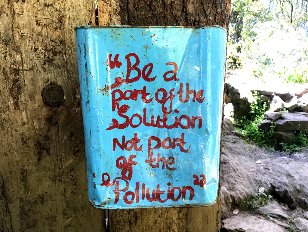 Blue bin with hand painted message on hike to Tango monastery.