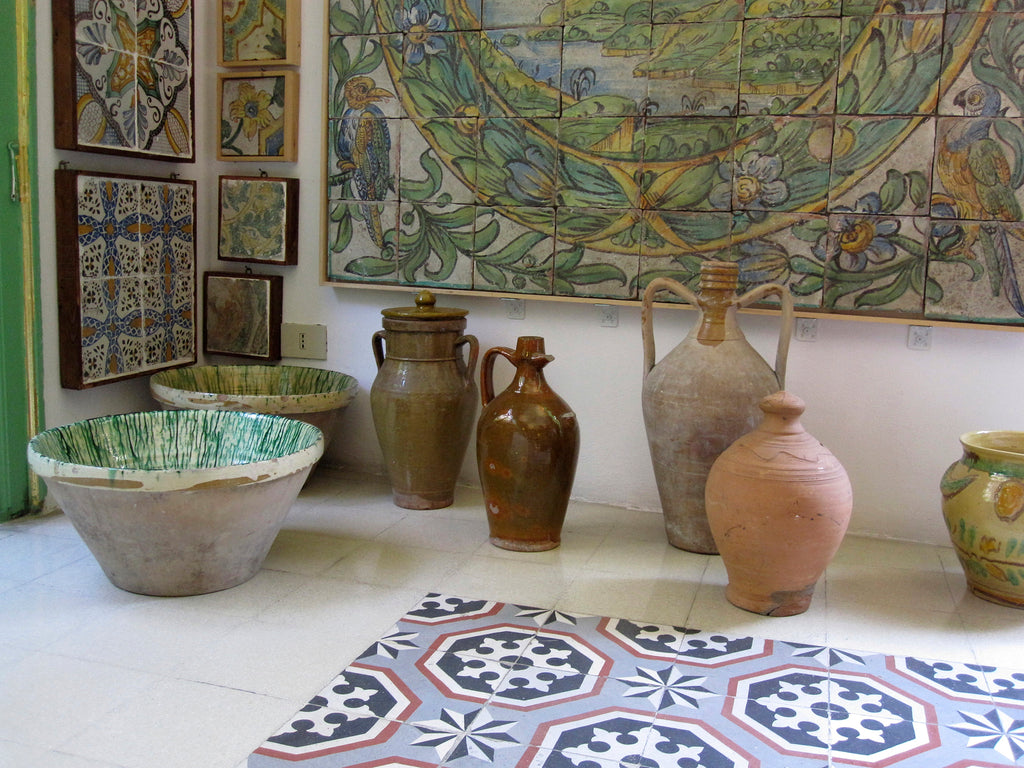 Photo of ceramic vases and tiles in Stanze al Genio tile museum in Palermo, Sicily.