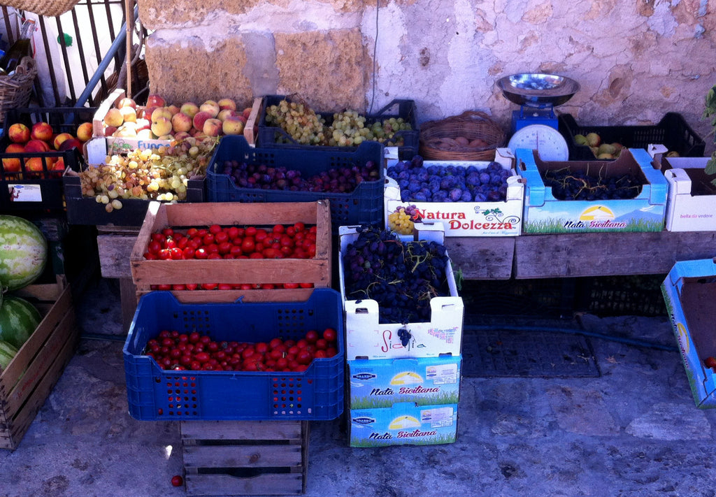 Photo of a fruit and vegetable market in Palermo, Sicily.