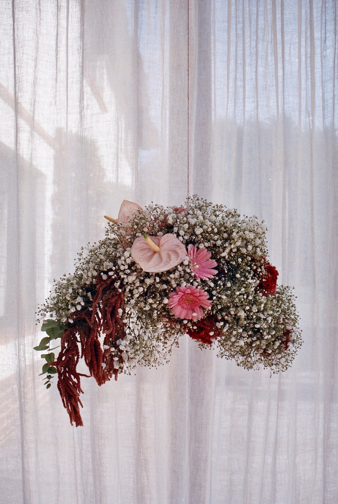 Hanging flower arrangement by 0K Studios.