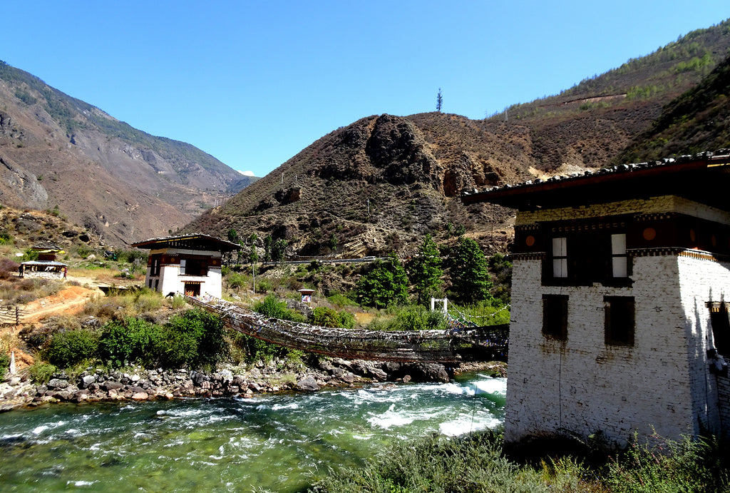 Tachog Lhakhang iron suspension bridge across the Paro Chu river in Bhutan.