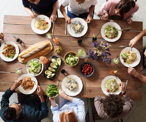 People eating at a garden table