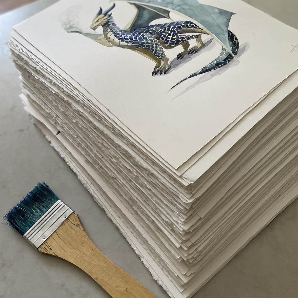 Wyrmspan Stack of dragon illustrations