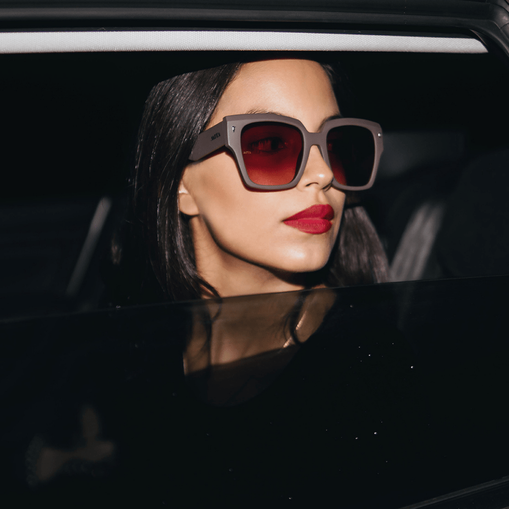 woman in car with sunglasses