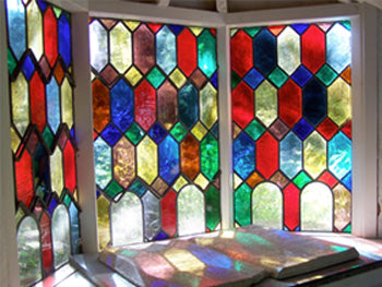 The tiny chapel, reminiscent of the roadside chapels found in Europe, with its stained glass window, Contains a marble tablet inscribed with biblical verses (Photo: Darren Harbar)