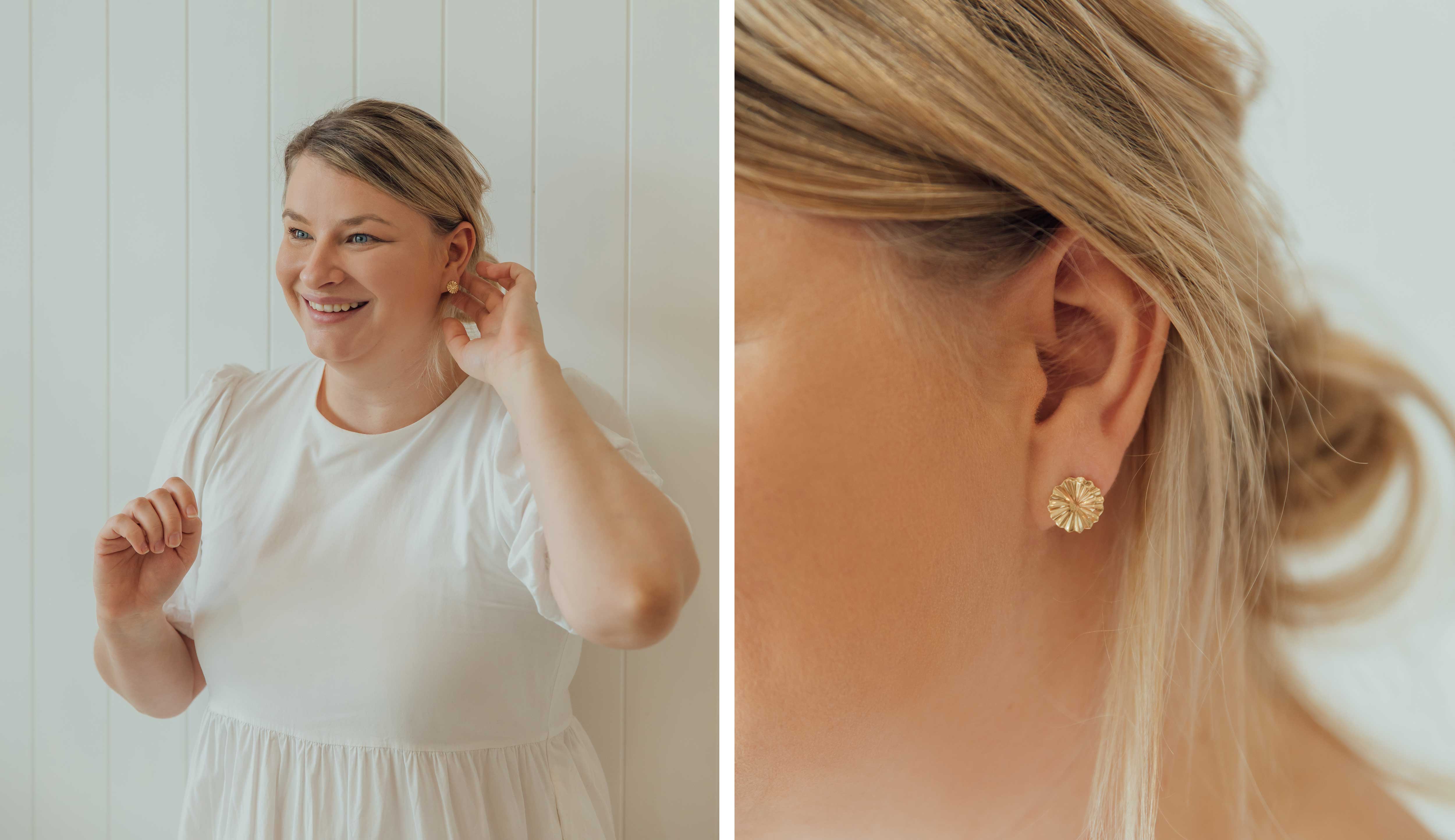 Helen, NMJ inventory manager wearing the Pan earrings in yellow gold