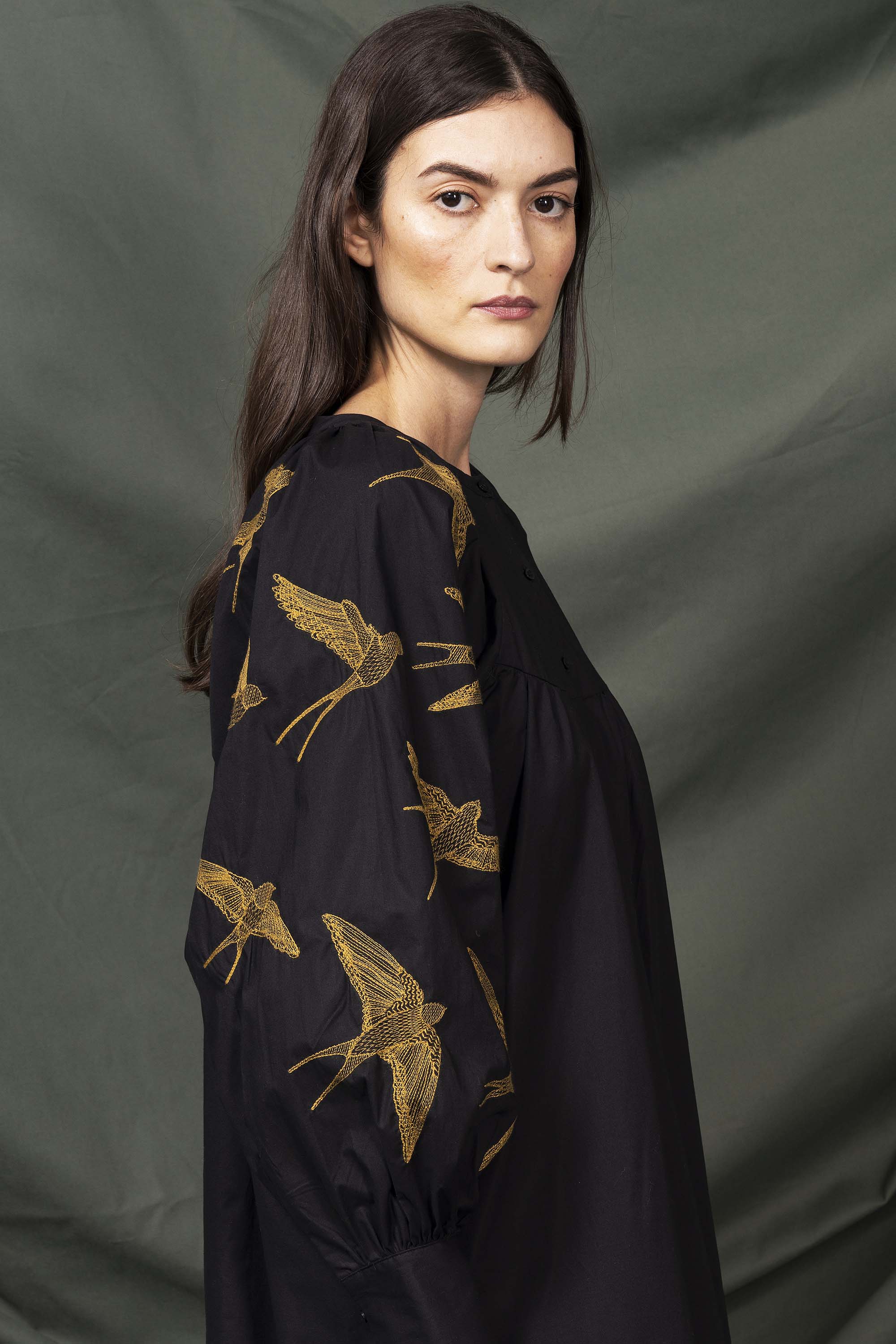 Black shirt dress with embroidered bird sleeves
