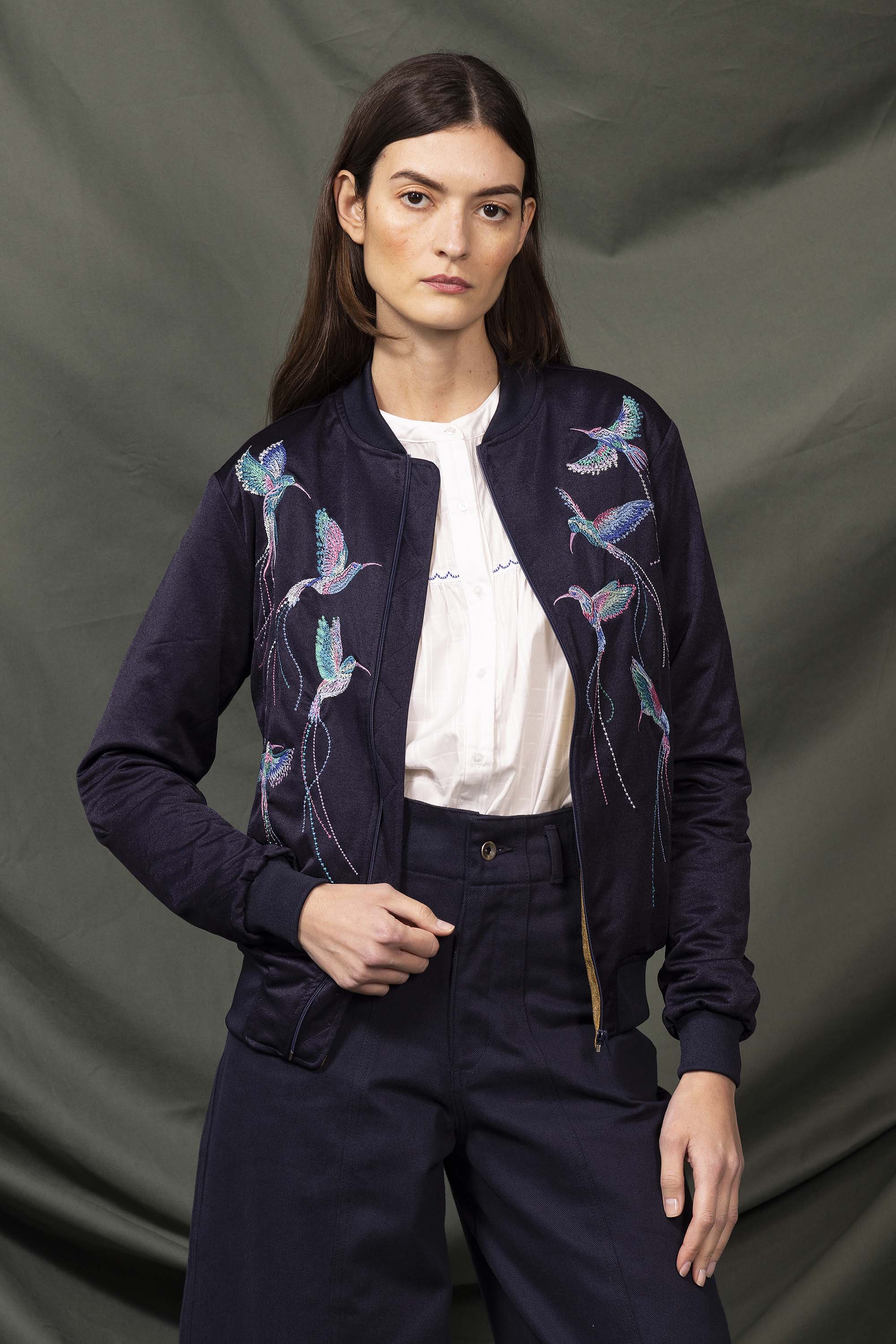 Navy souvenir bomber jacket with hummingbird embroidery on the back