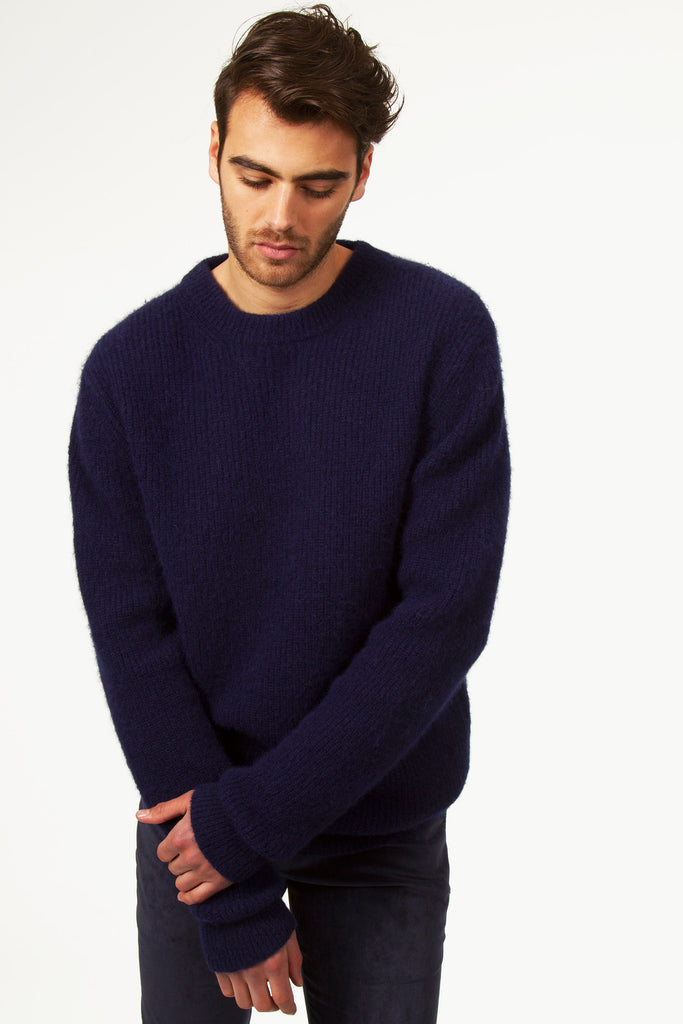 Man looking down on the ground navy blue sweater in textured knit round neck in alpaca knit thick and warm to go to work masculine trend timeless basics of quality