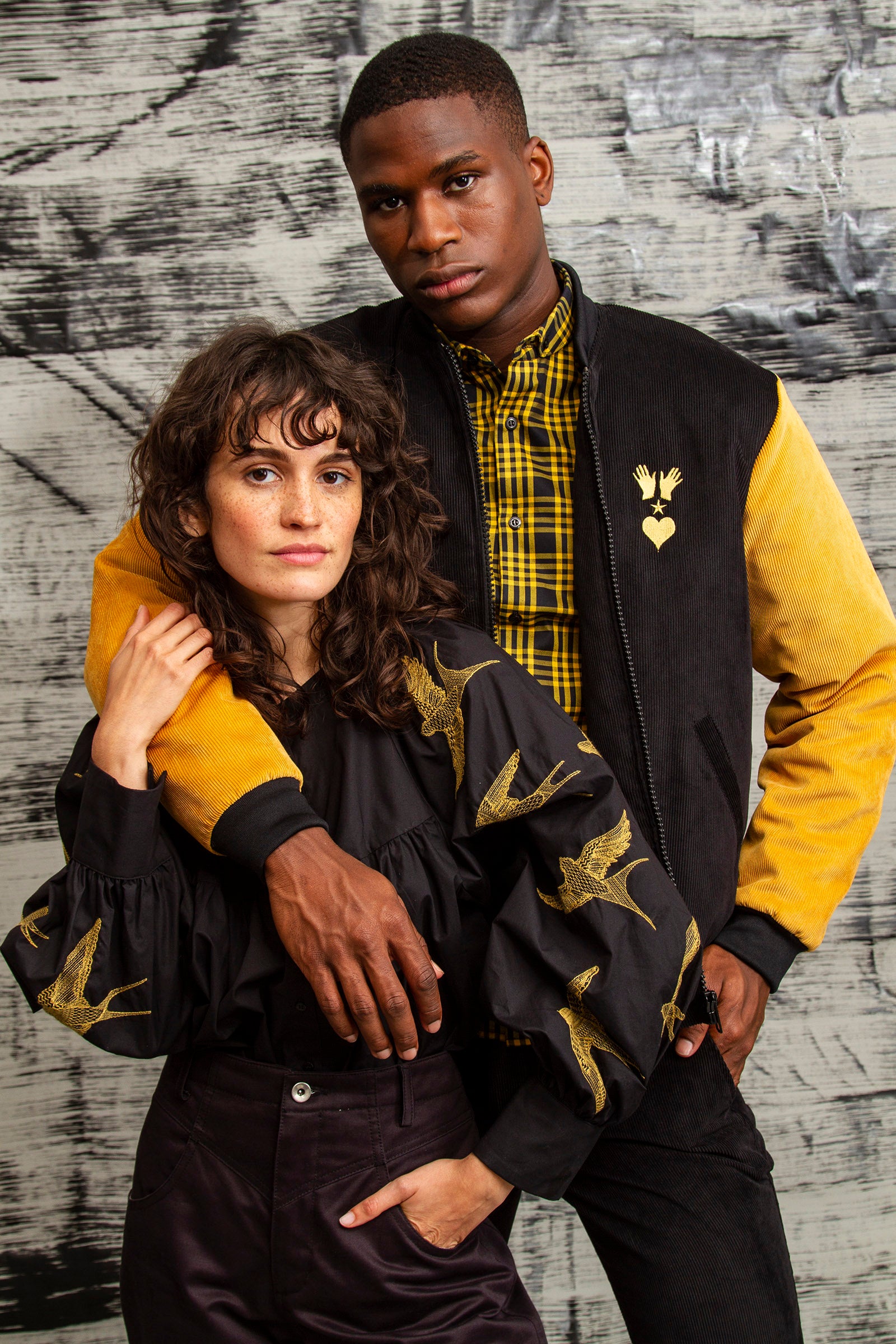 black cotton shirt with bird embroidery on the arms loose fit and black and yellow velvet jacket with ribbed collar