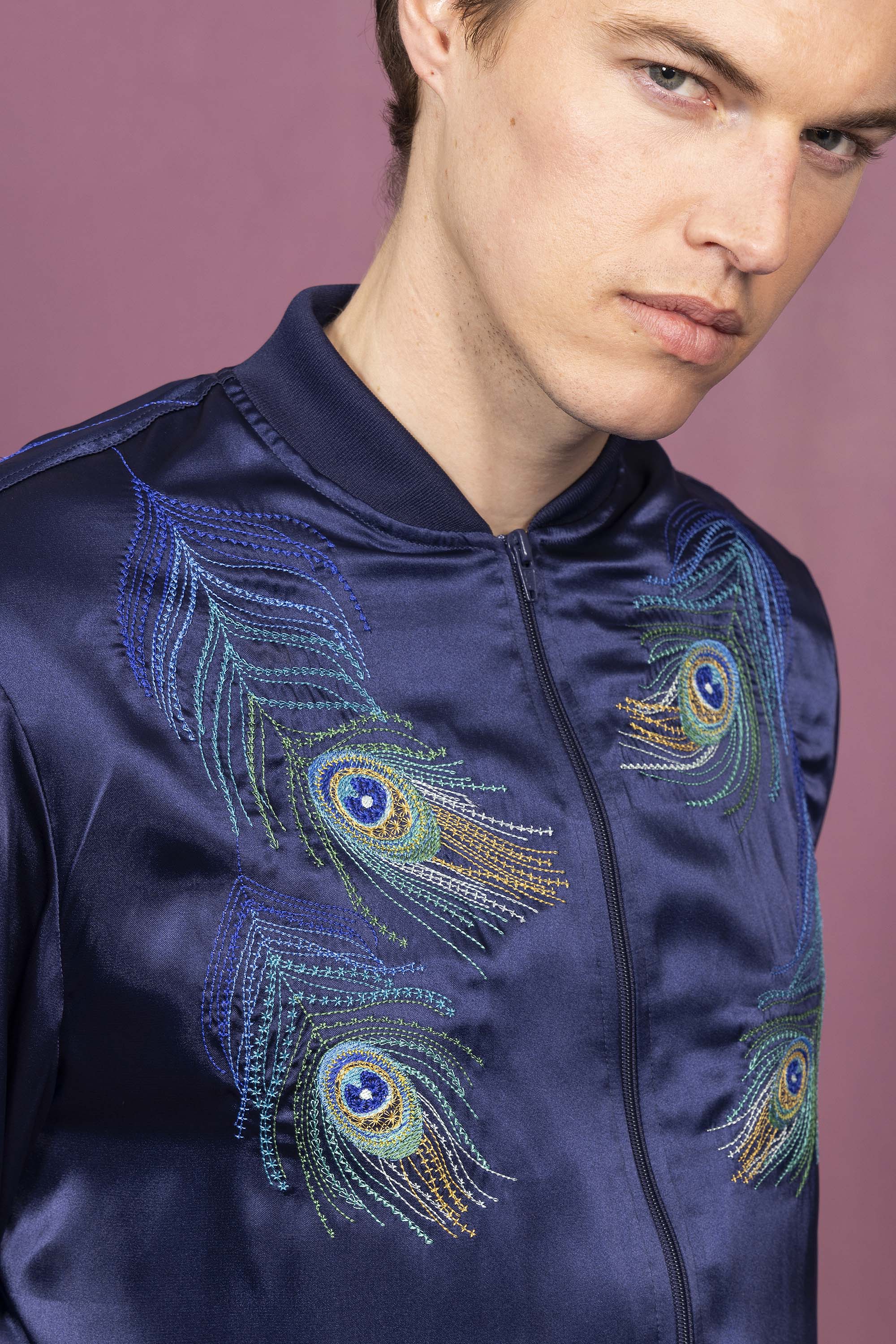 Souvenir bomber jacket with more peacock embroidery on the front and on the back, handmade in Peru at the Misericordia workshop
