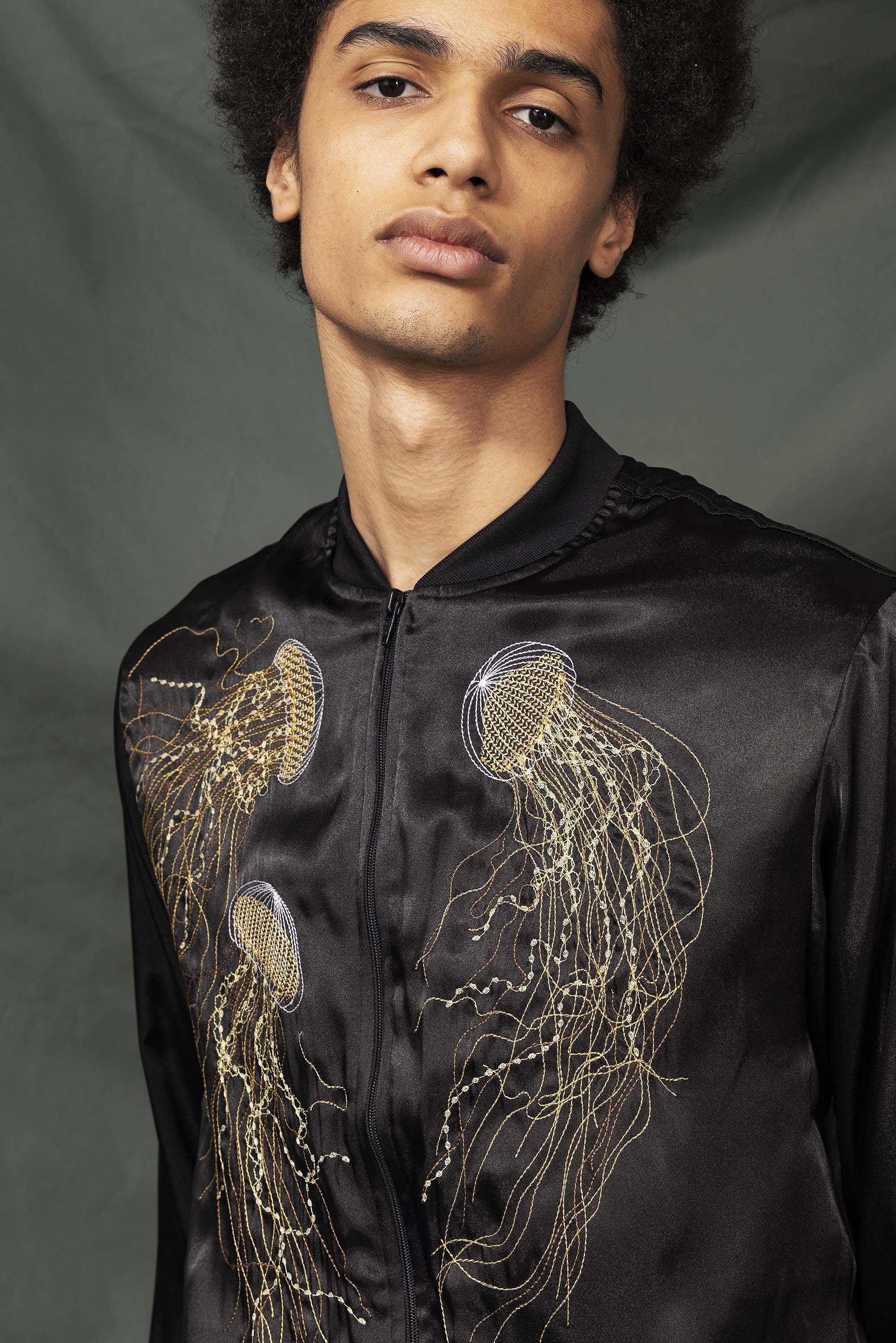 Black souvenir bomber jacket with jellyfish embroidery on the back and front, made in Lima in the Misericordia workshop