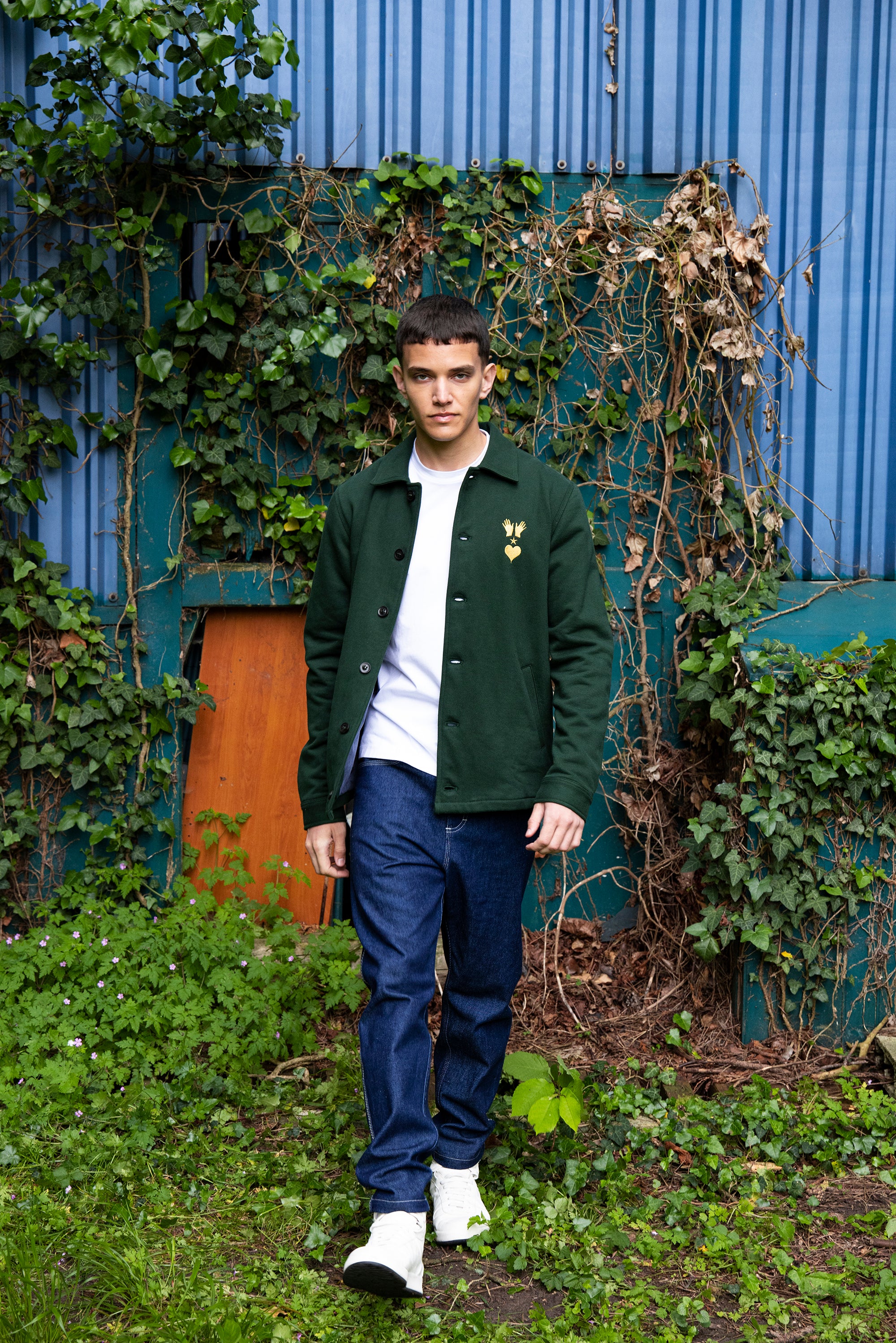 dark green buttoned cotton jacket with embroidered logo